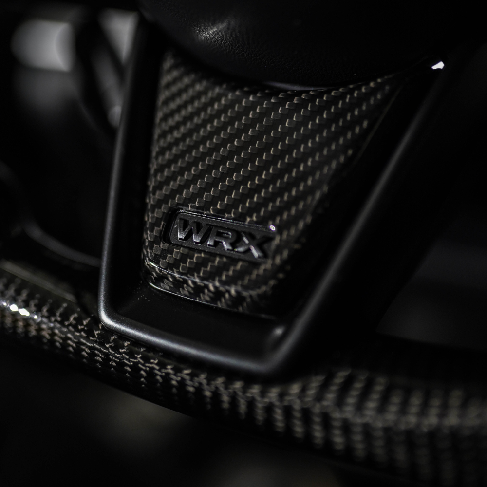 JDMuscle 22-25 WRX Tanso Carbon Fiber Steering Wheel Lower Trim Cover