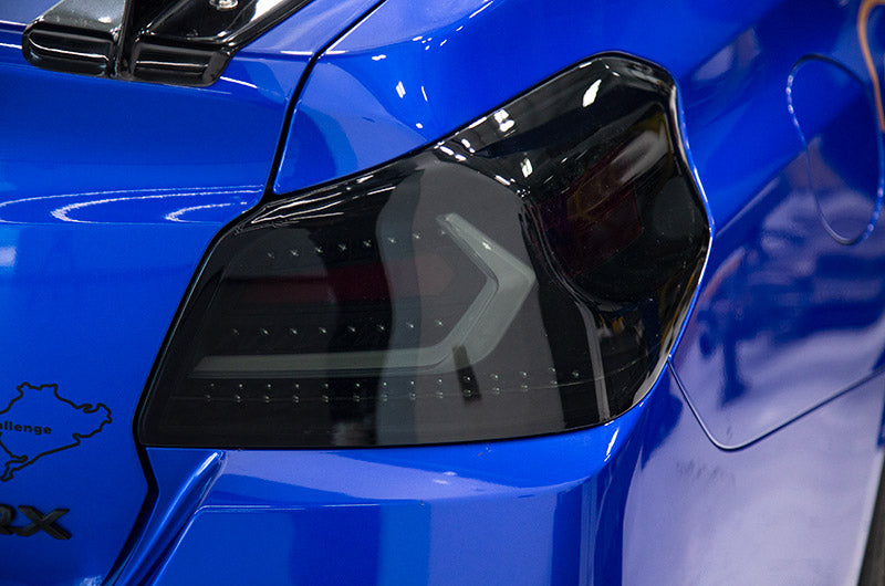 OLM Evolution Tail Lights (Smoked Lens, Black Base, White Bar) - 15+ WRX / STI